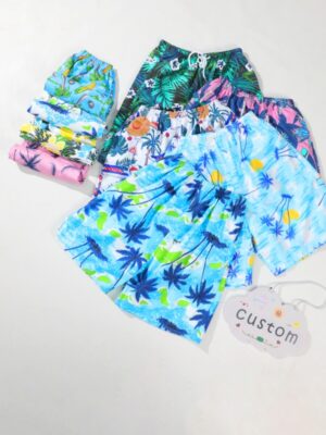 Hawaiian Tropical Palm Coconut Tree All Over Print Kids Beach Shorts Elastic Adjustable Drawstring Waist Loose Wide Leg Quick Dry Lightweight Fabric Toddler Boys Summer Pool Vacation Swim Board Shorts Multiple Island Floral Pattern Options